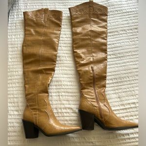 Thigh high tan boots!